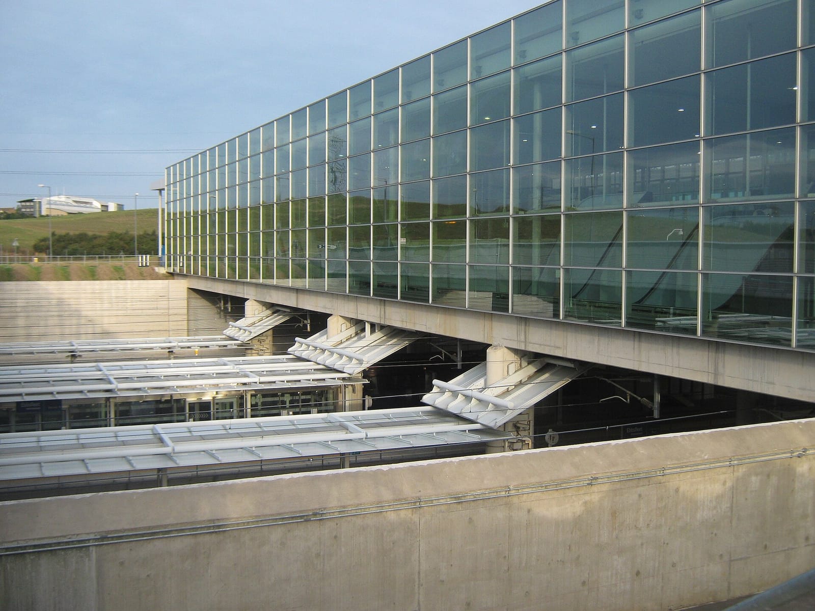 The glazed frontage of Ebbsfleet International station above the platforms.
